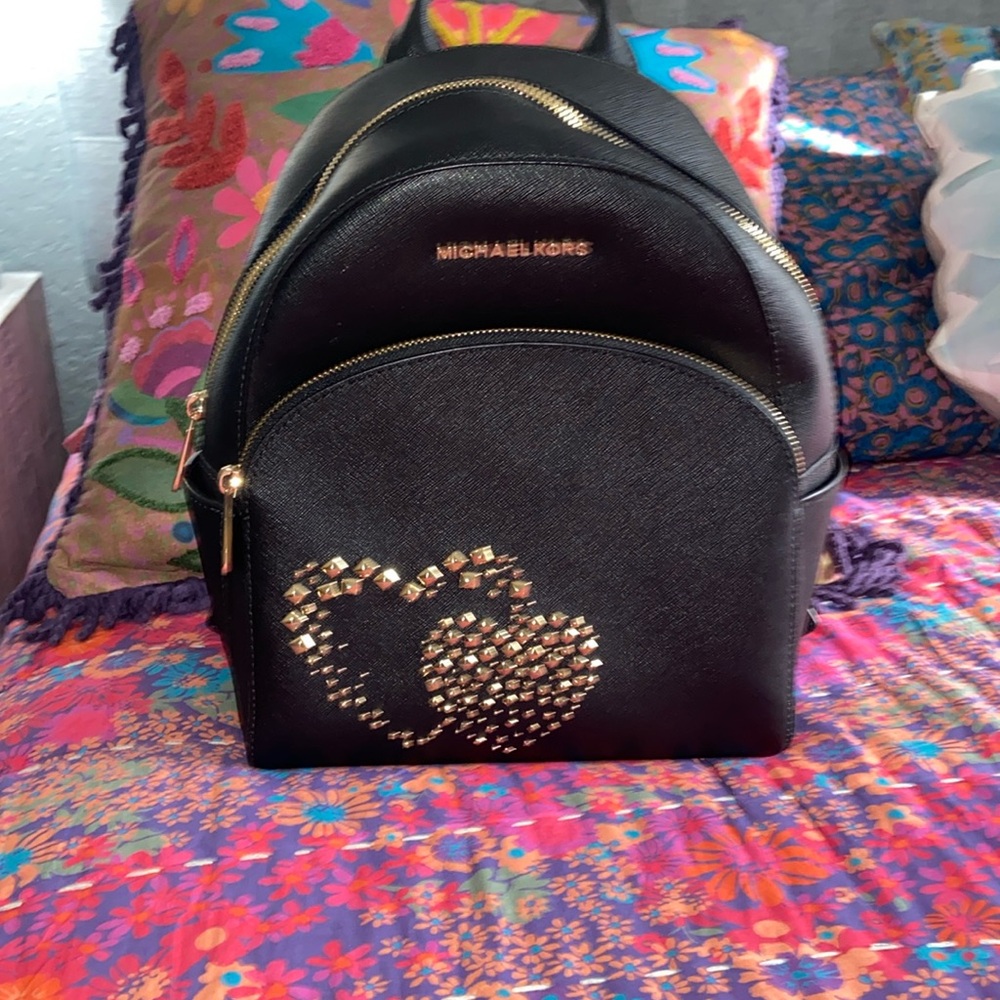 I don’t use it anymore. Beautiful MK backpack with the gold studded hearts.